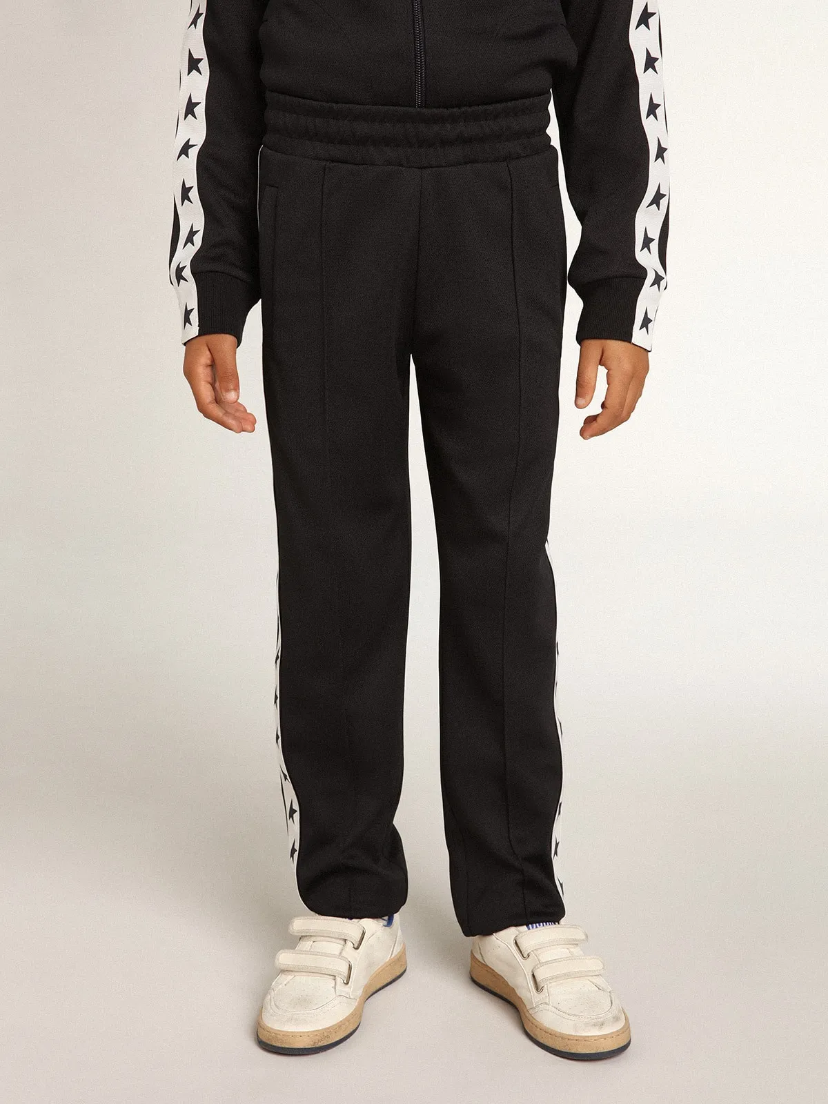 Dark blue joggers with white strip and contrasting stars